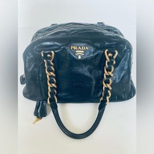 Authentic Prada black medium size leather shoulder/hand bag.